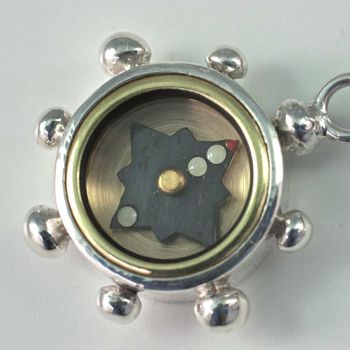 Silver Compass made in the shape of a Ship's Wheel