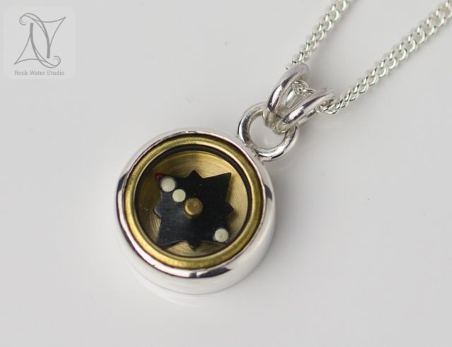 Silver Compass Pendant for a Man image of silver compass necklace for a man