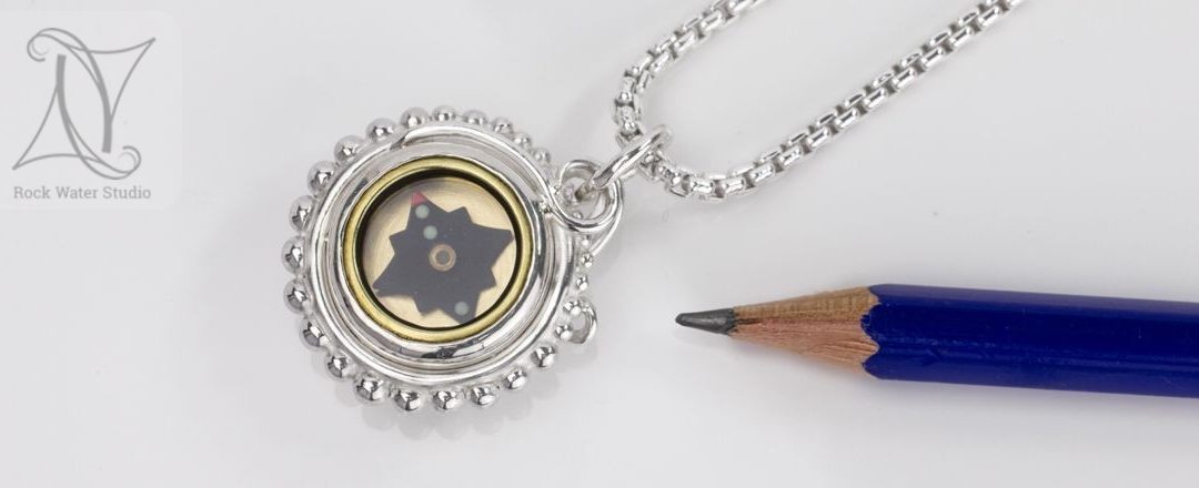 Looking for a graduation compass necklace?
