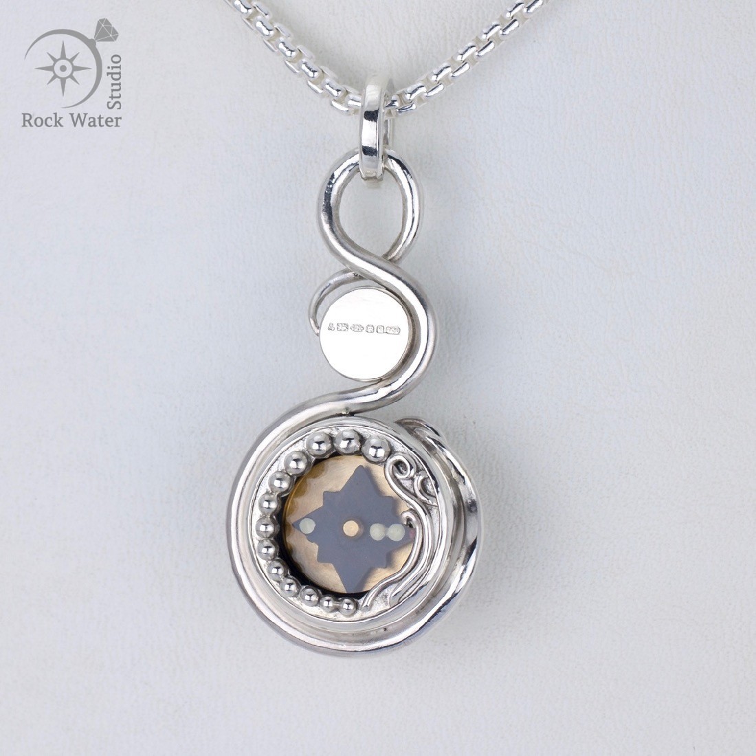 botanical compass necklace with moonstone and sapphire
